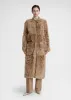 Curly shearling coat biscuit sold by Toteme