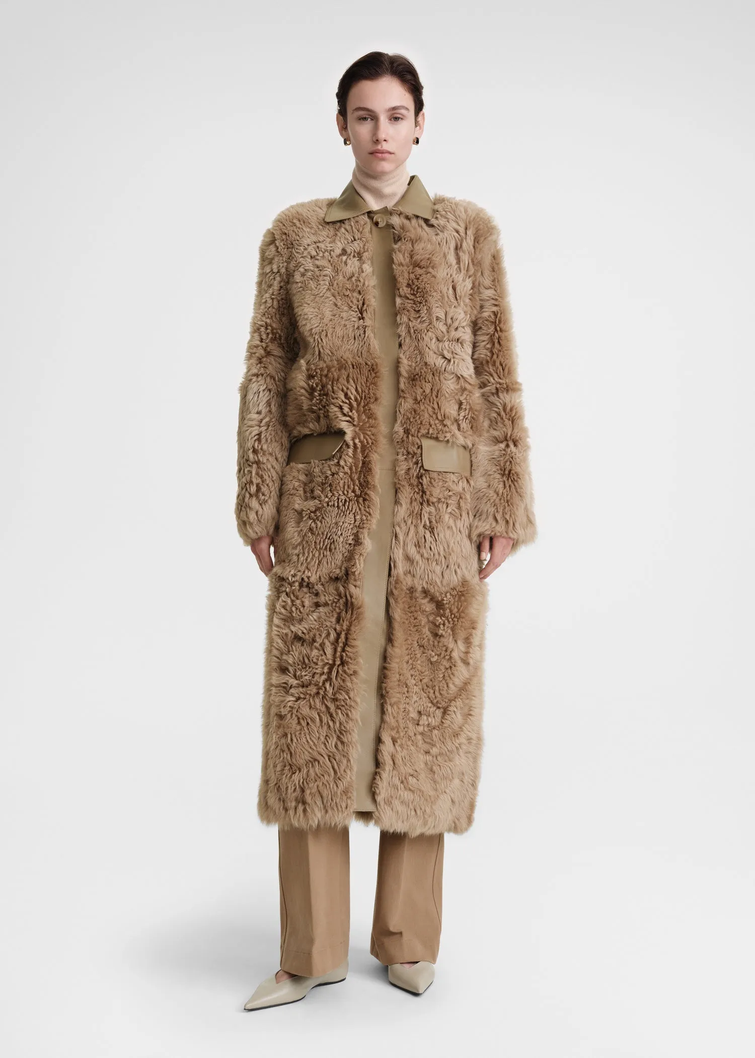 Curly shearling coat biscuit sold by Toteme
