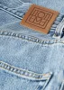 Tapered leg denim worn blue sold by Toteme