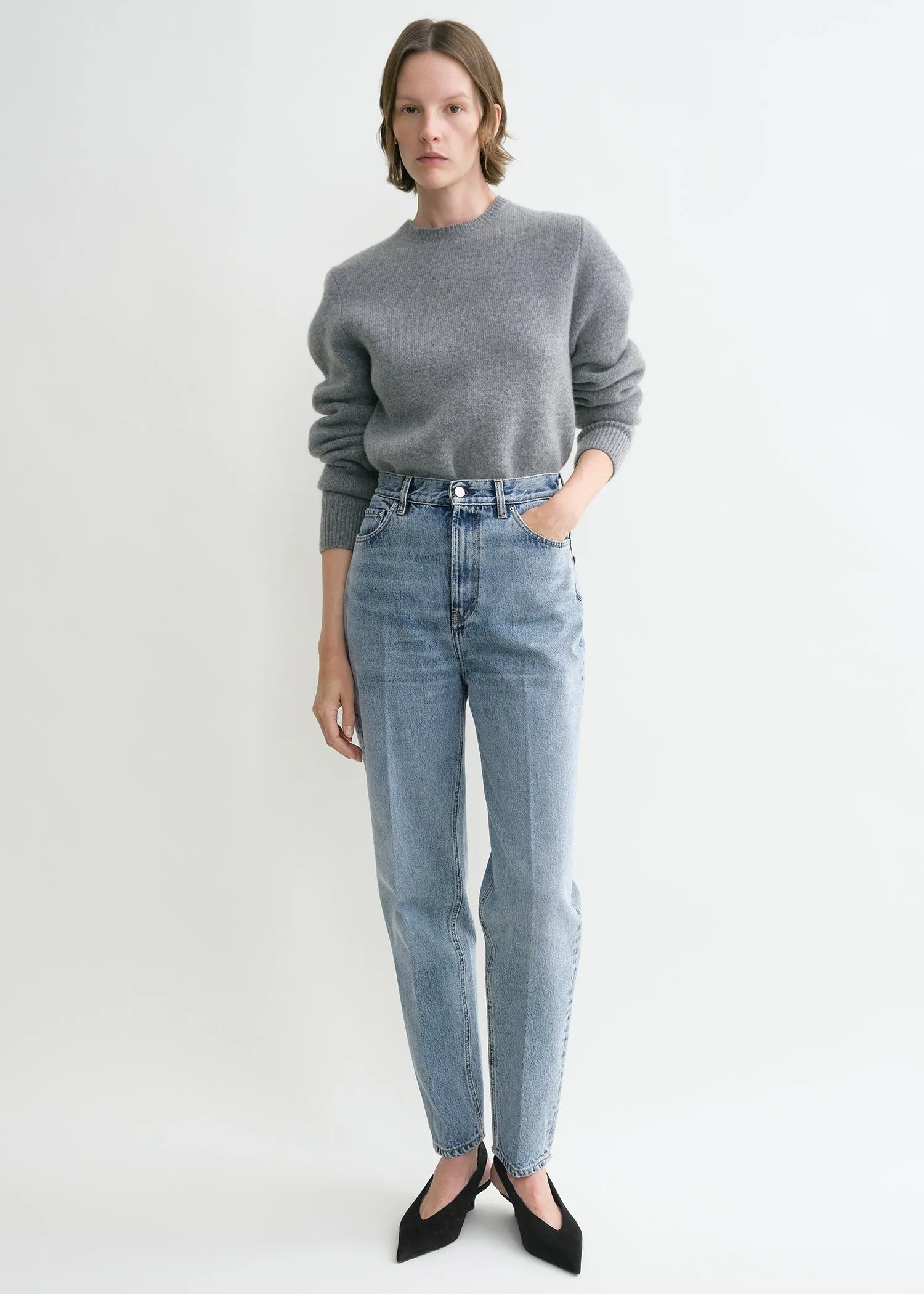 Tapered leg denim worn blue sold by Toteme