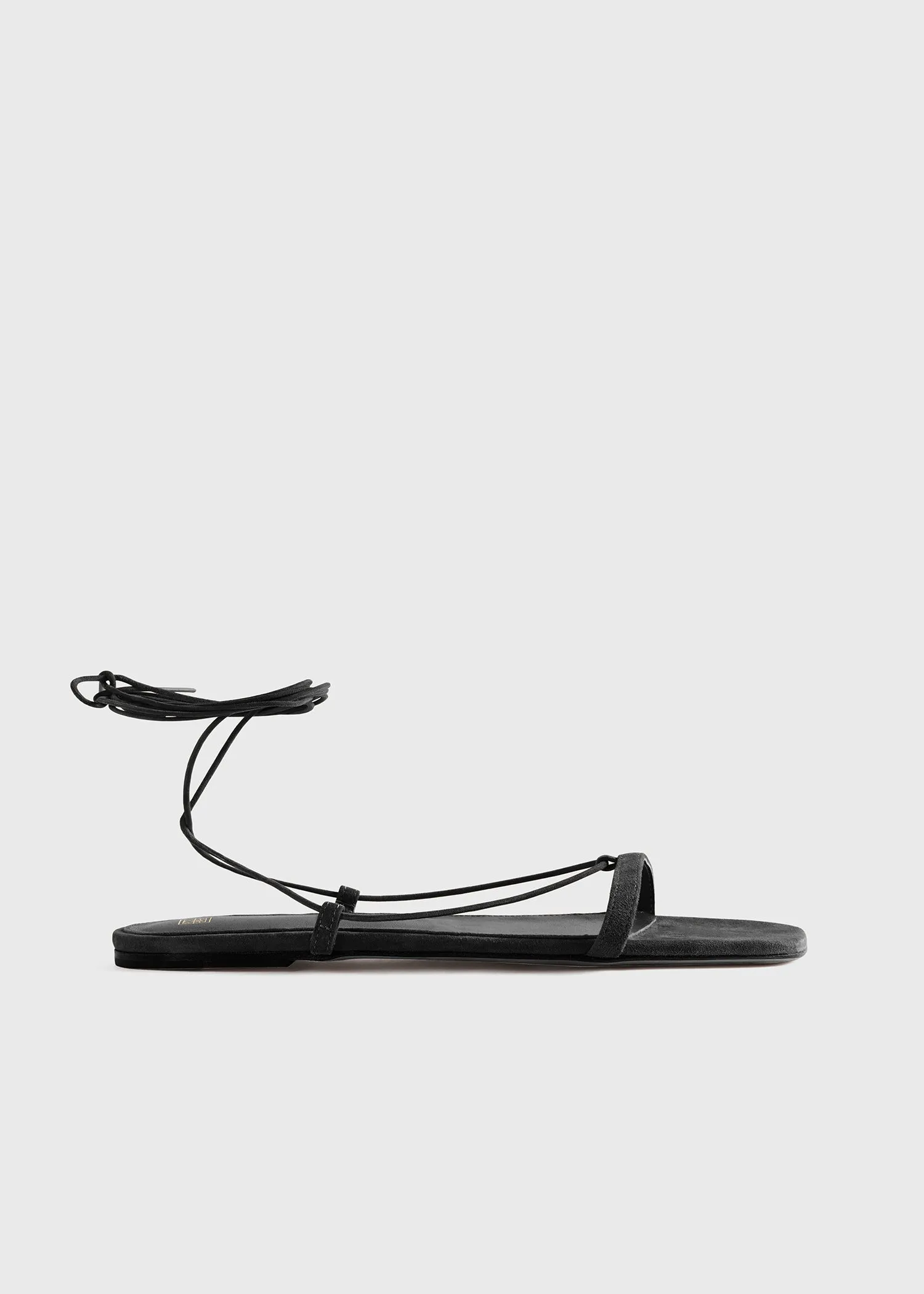 The Suede Tie Sandal black sold by Toteme
