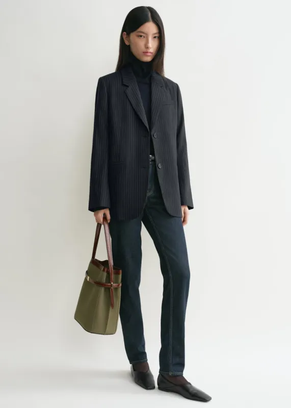 Tailored pinstriped suit jacket navy sold by Toteme