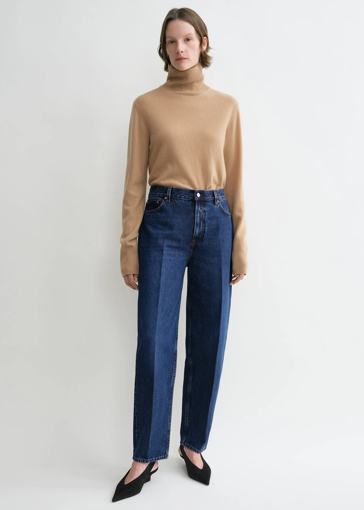 Wide tapered leg denim dark blue sold by Toteme