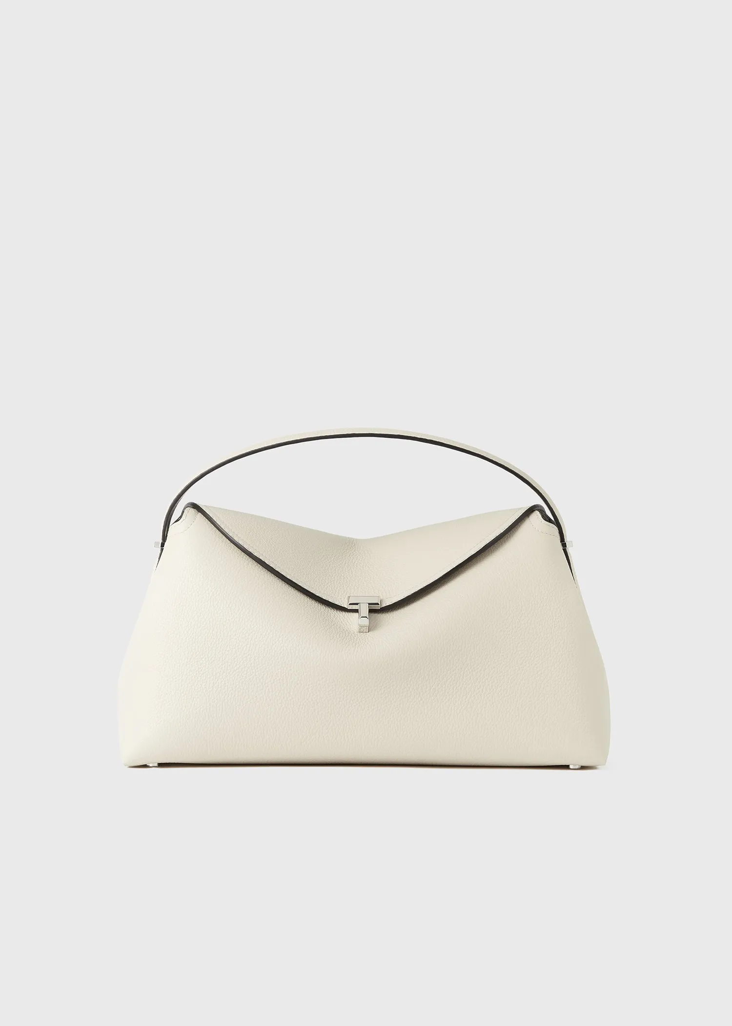 T-lock grained-leather top handle milk sold by Toteme