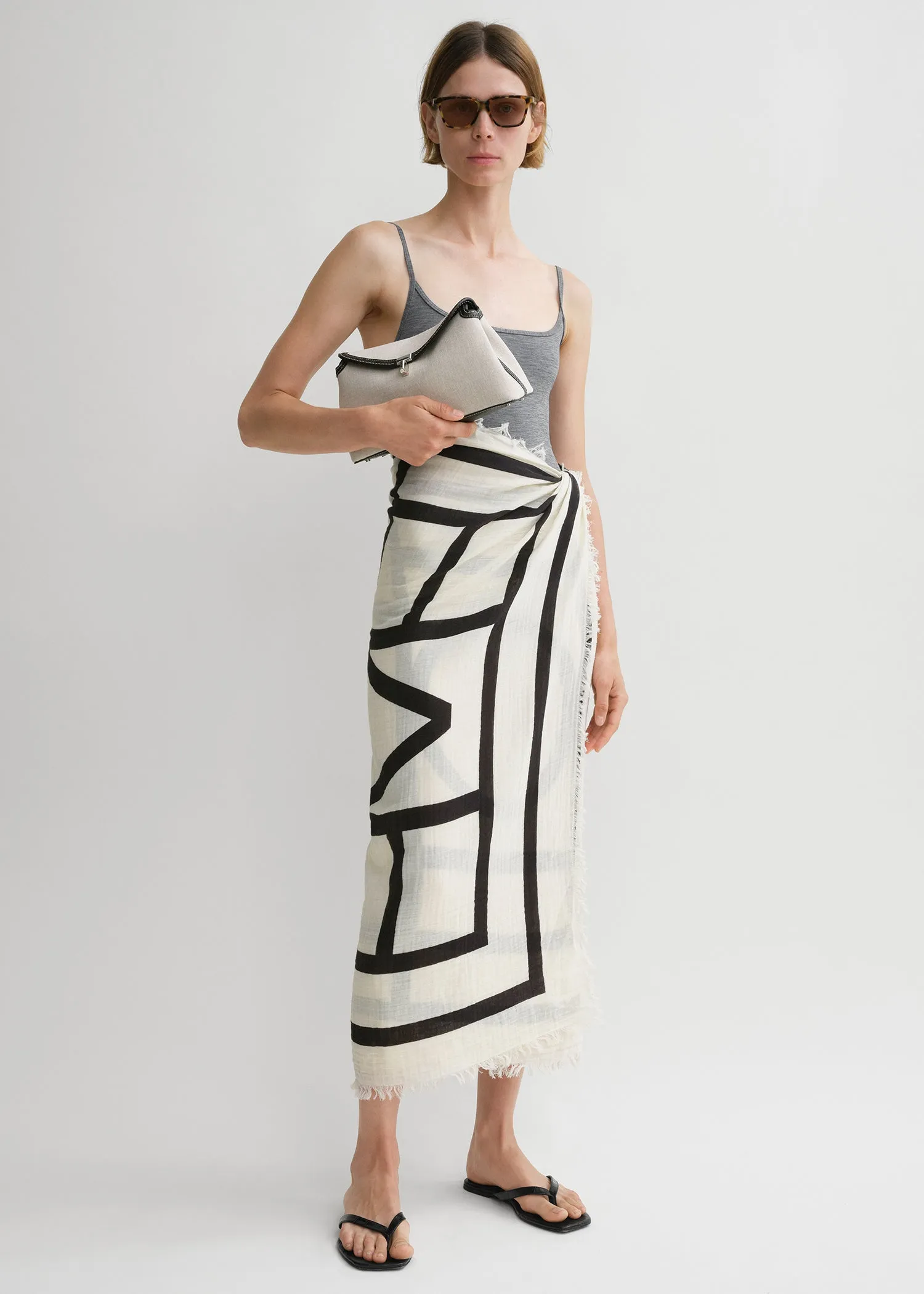 Monogram beach sarong ecru/black sold by Toteme