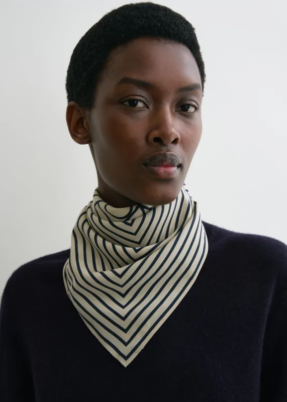 Signature monogram silk scarf crème sold by Toteme