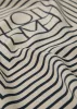 Signature monogram silk scarf crème sold by Toteme
