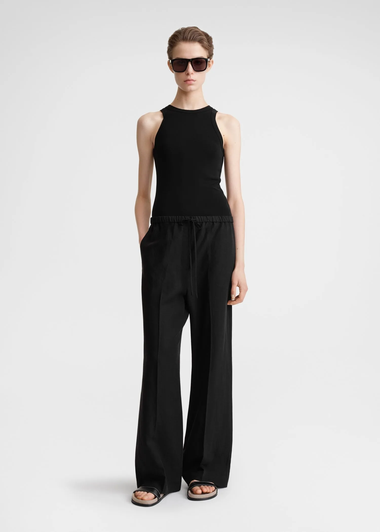 Fluid drawstring trousers black sold by Toteme