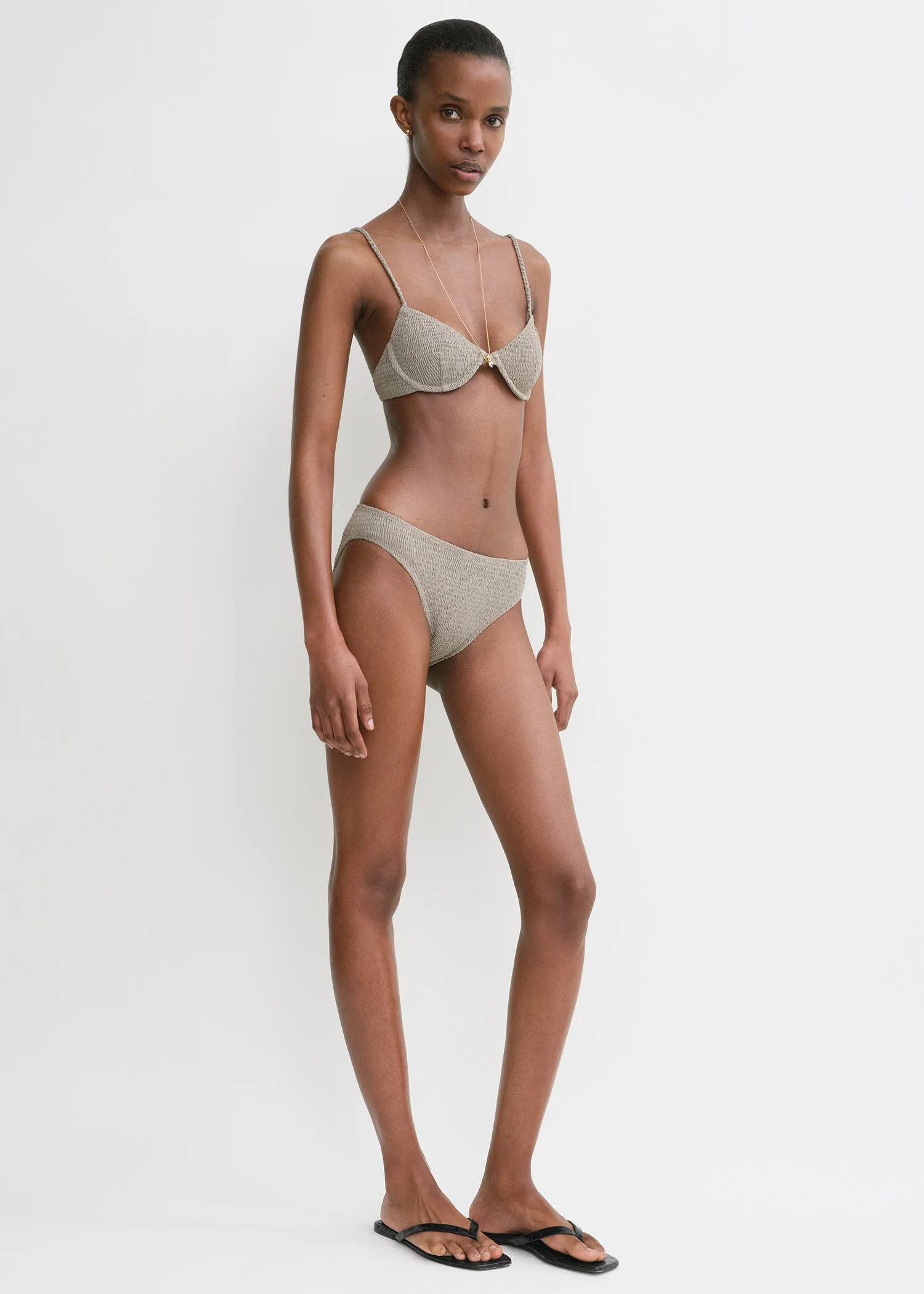 Smocked half-cup bikini top dove sold by Toteme