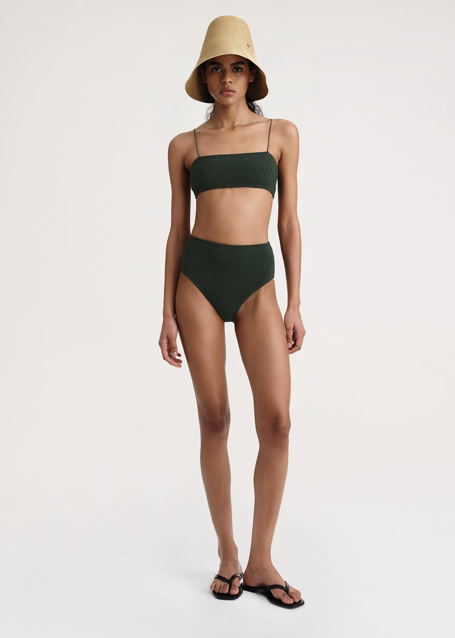 Smocked bikini bottoms dark green sold by Toteme