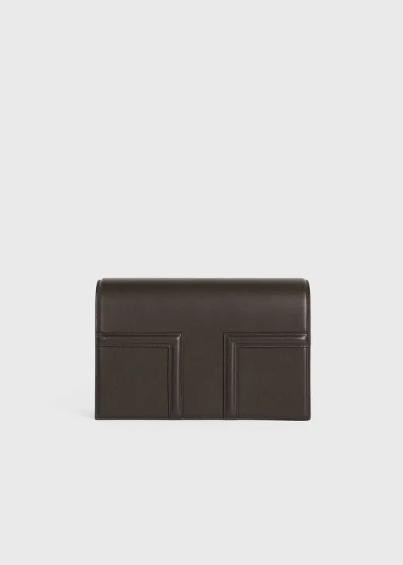 T-Flap leather bag coffee sold by Toteme