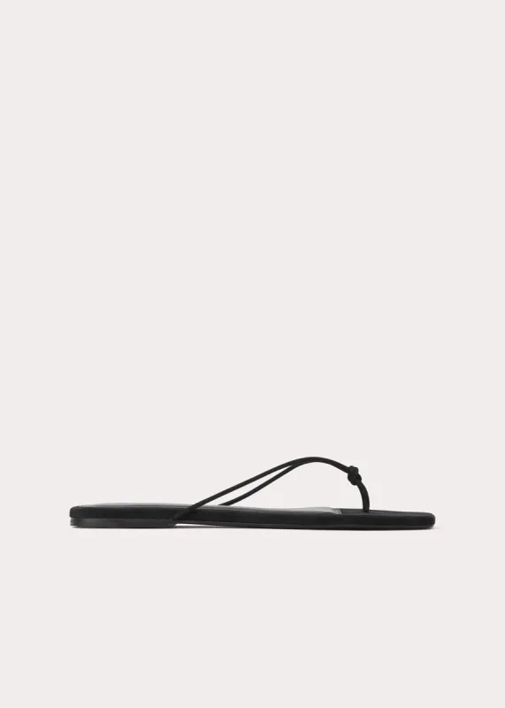 Knotted leather flip flops black sold by Toteme