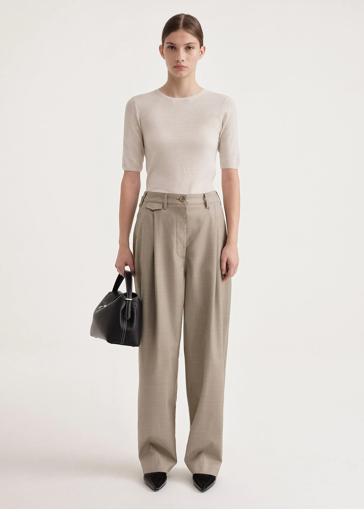 Fluid wool button trousers light hay mélange sold by Toteme
