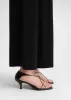 The Leather Knot Sandal black sold by Toteme