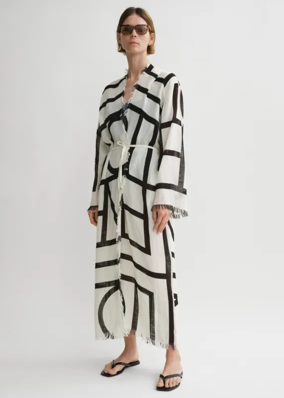 Monogram wrap dress ecru/black sold by Toteme