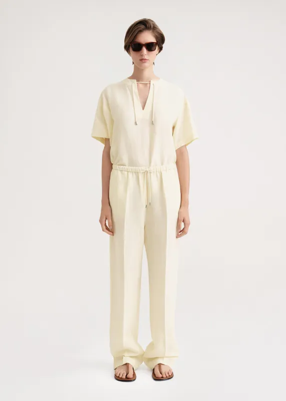 Press-creased drawstring trousers vanilla sold by Toteme