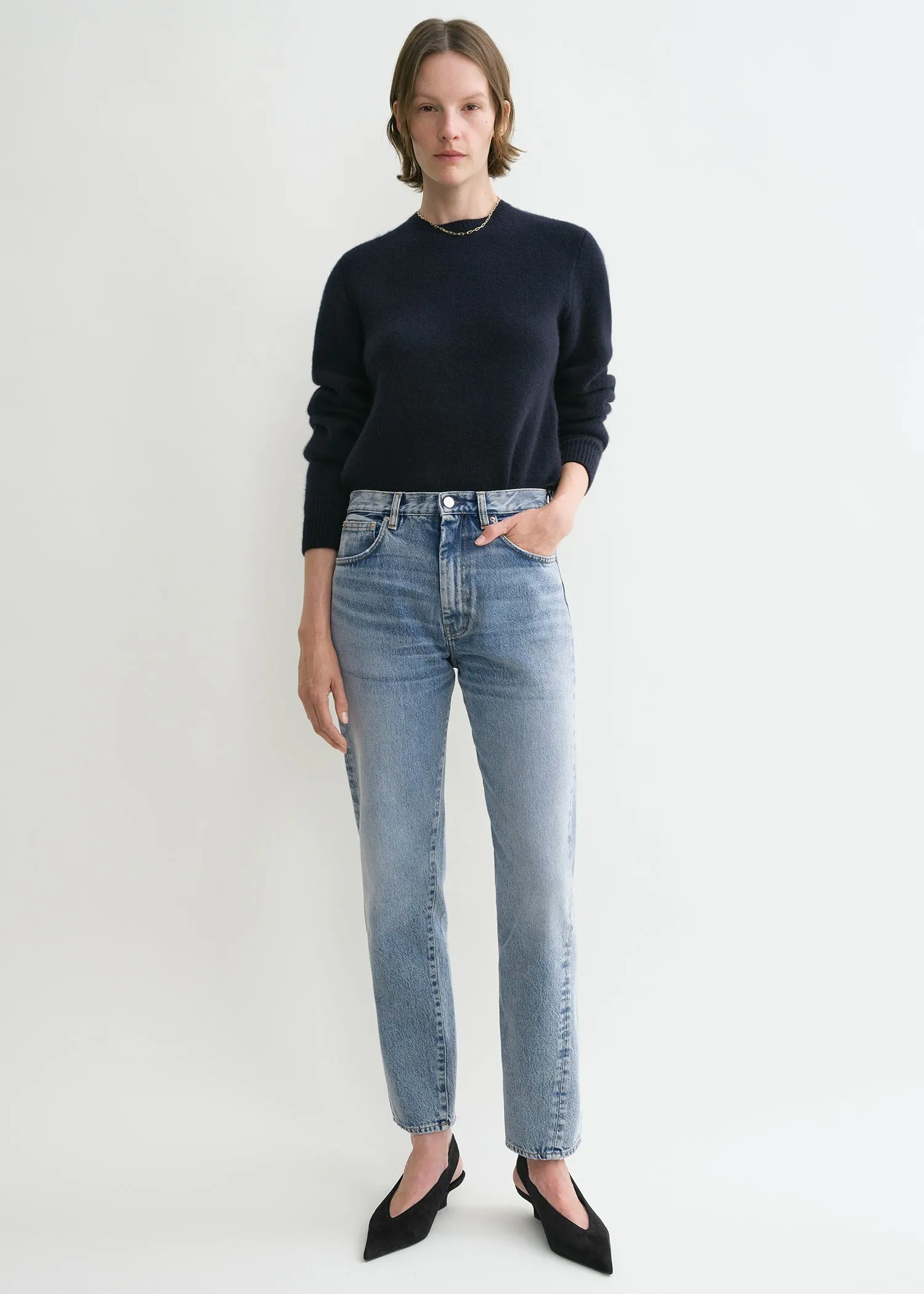 Twisted seam denim worn blue sold by Toteme