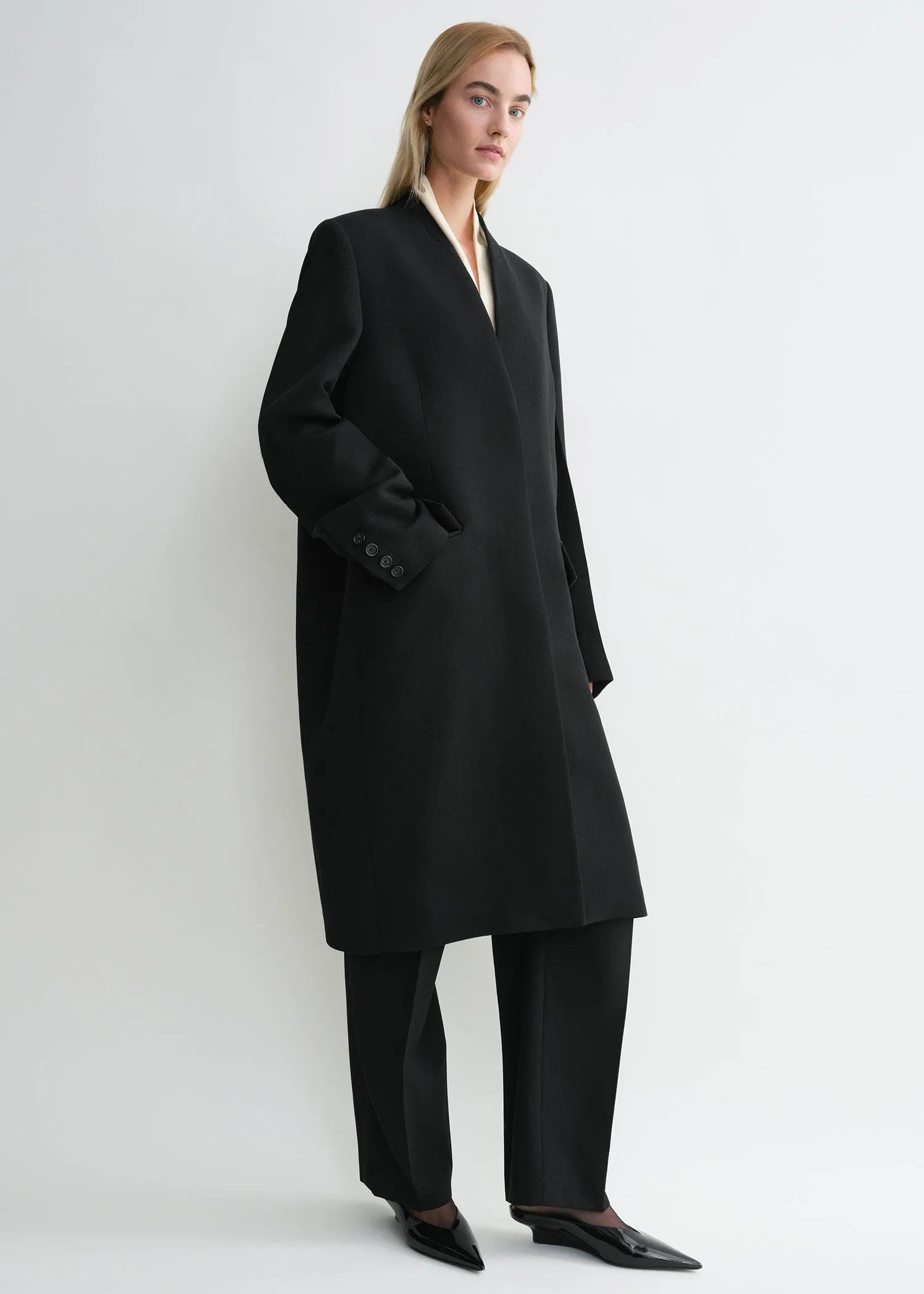 Deep pleat coat black sold by Toteme