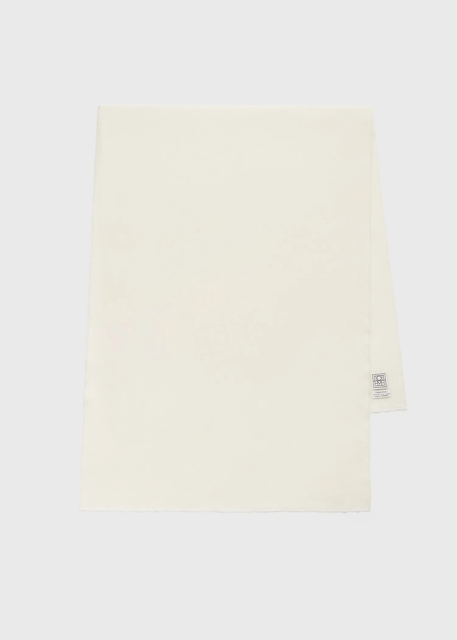 Wide classic wool scarf ivory sold by Toteme