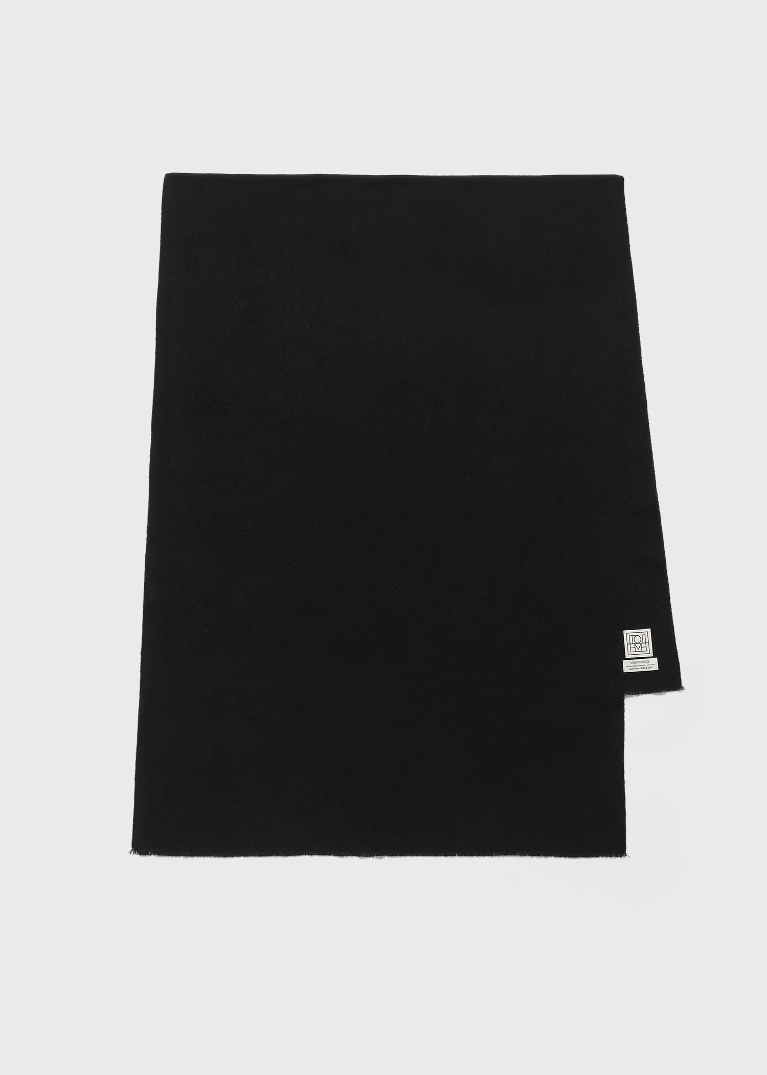Wide classic wool scarf black sold by Toteme