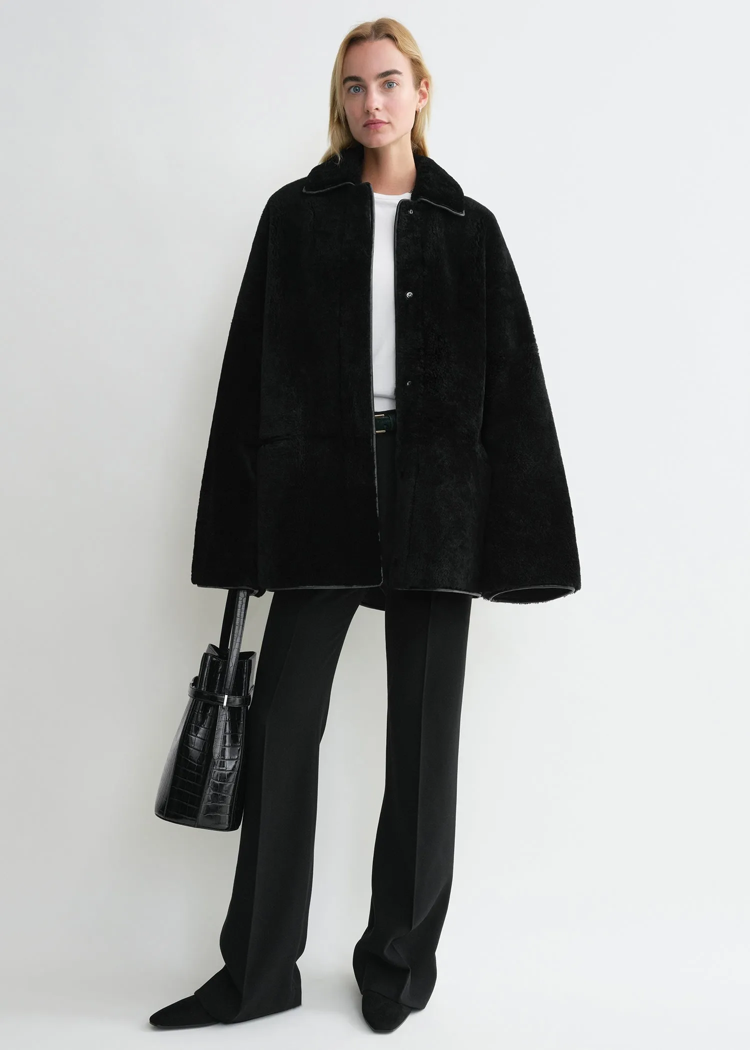Teddy shearling overshirt jacket black sold by Toteme
