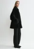 Teddy shearling overshirt jacket black sold by Toteme
