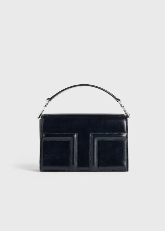 Mini T-Flap Naplack bag navy sold by Toteme