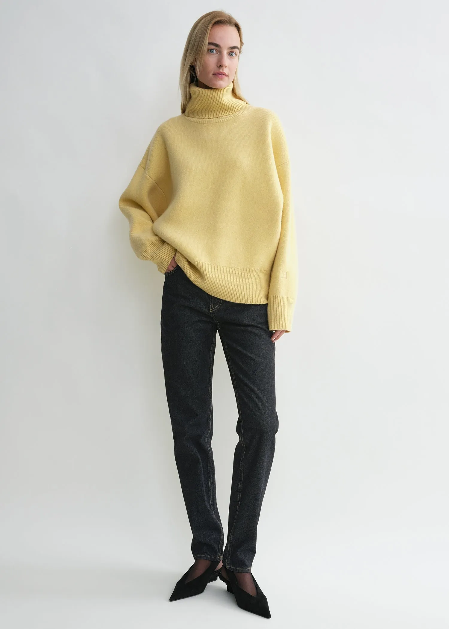 Double-knit turtleneck soft yellow sold by Toteme