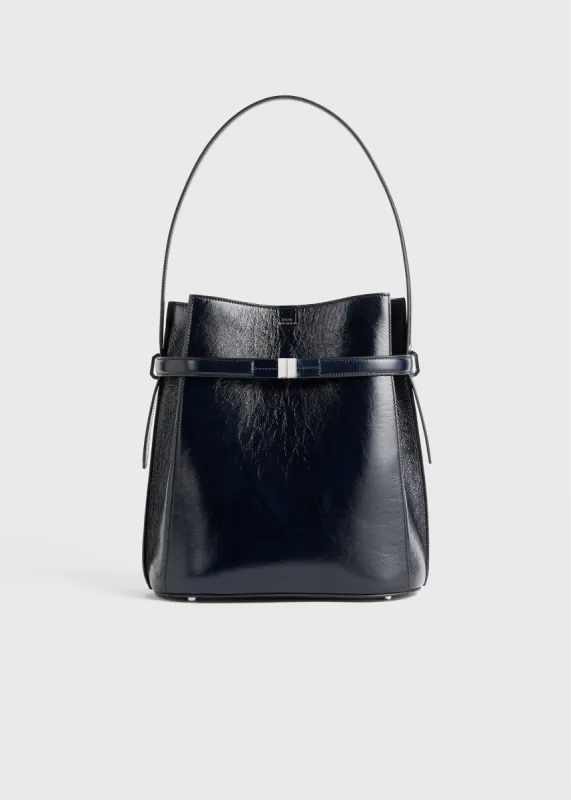 Belted Naplack bucket bag navy sold by Toteme
