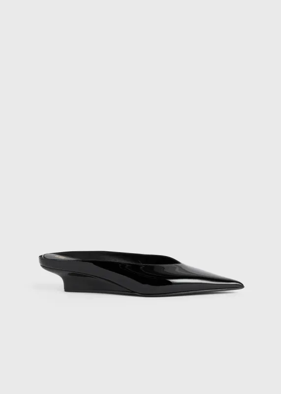 Sharp patent wedge mules black sold by Toteme