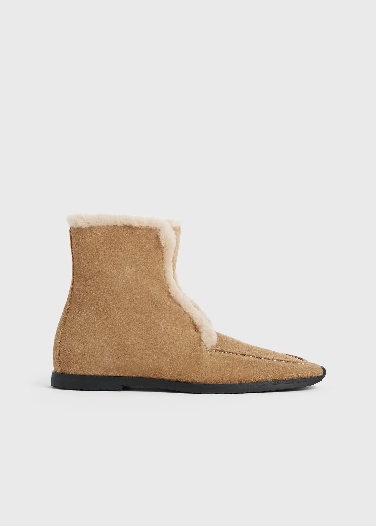 Shearling-edge winter boots caramel/ecru sold by Toteme