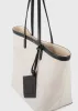 Canvas travel tote ecru/black sold by Toteme