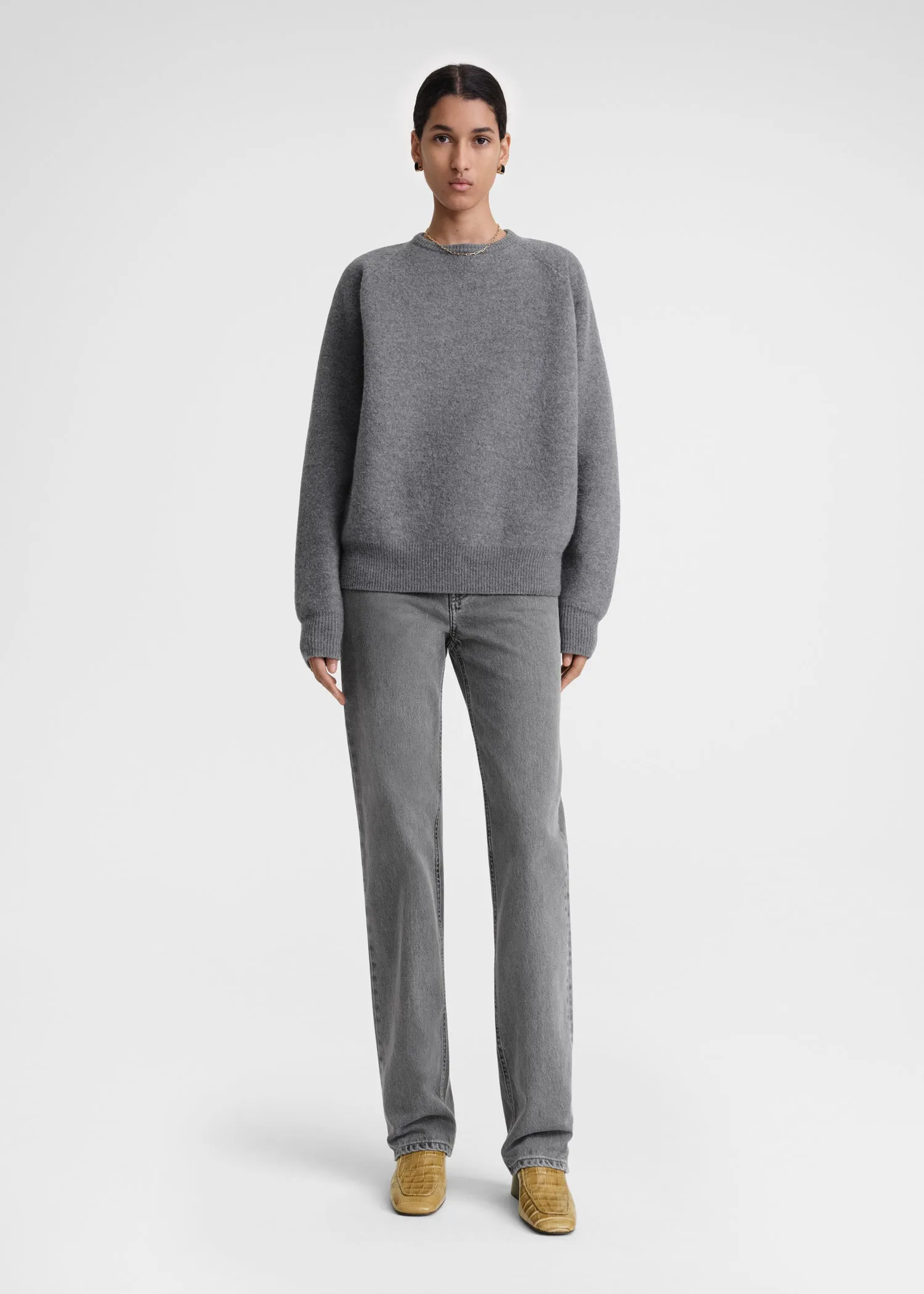 Crew-neck wool knit grey mélange sold by Toteme