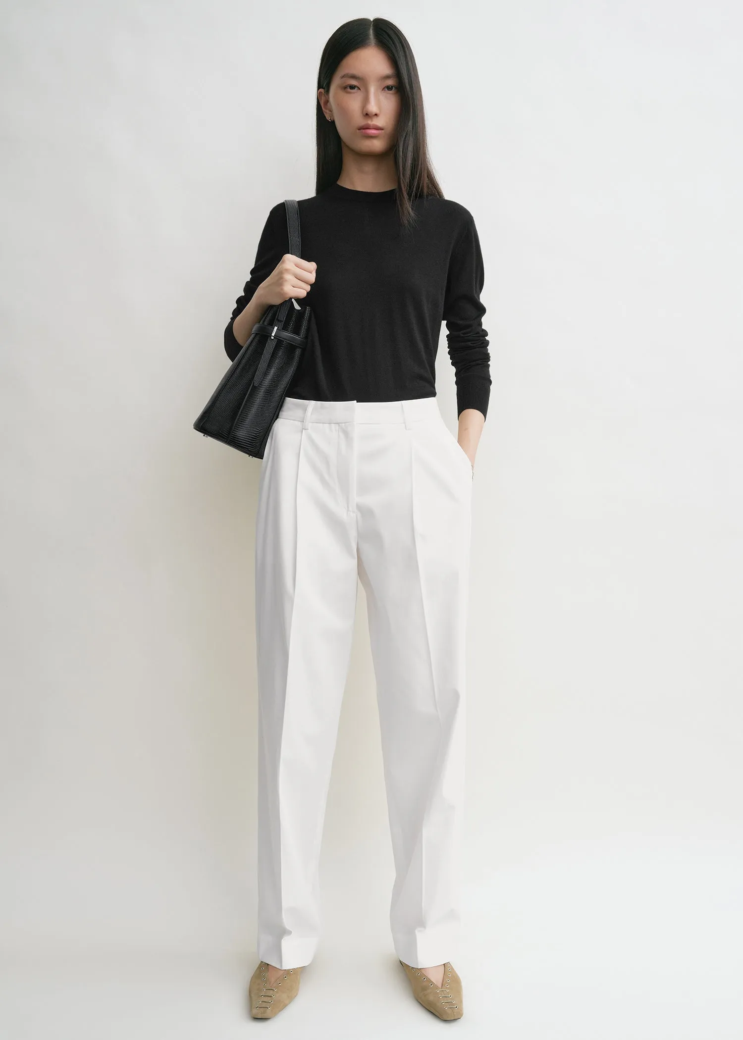 Slanted pocket trousers white sold by Toteme