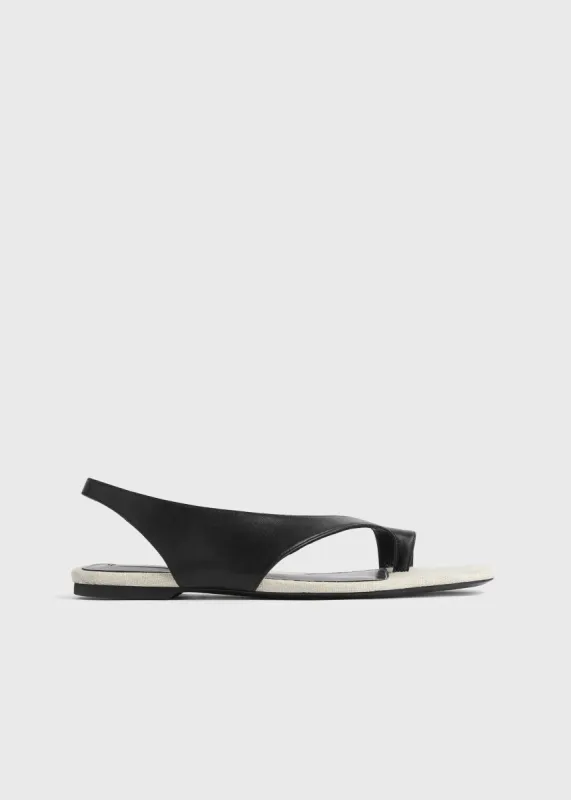 Leather thong sandals black/sand sold by Toteme