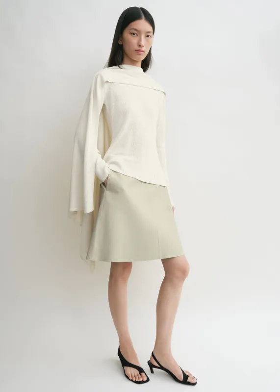 Cape knit ecru sold by Toteme