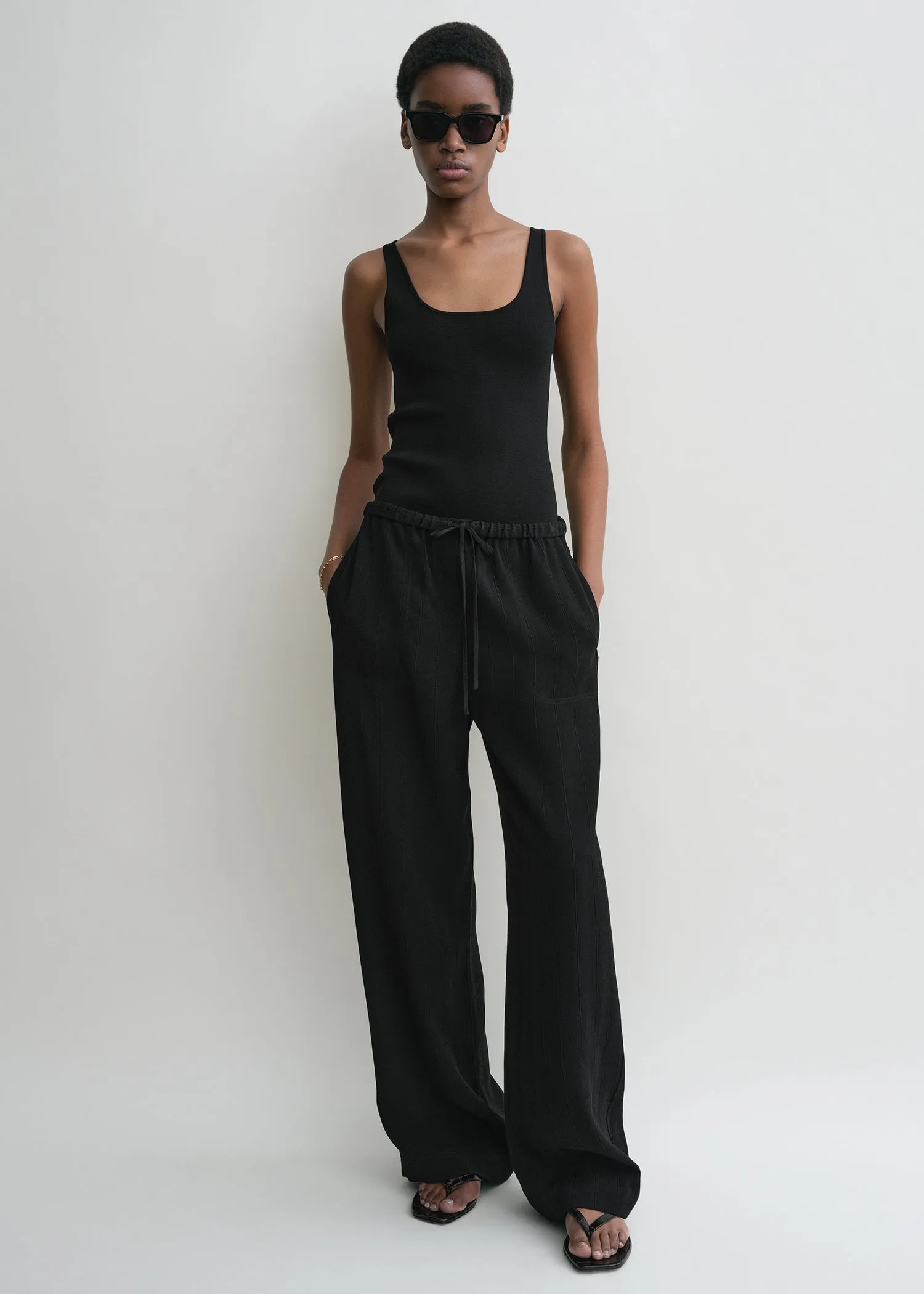 Woven stripe drawstring trousers black sold by Toteme