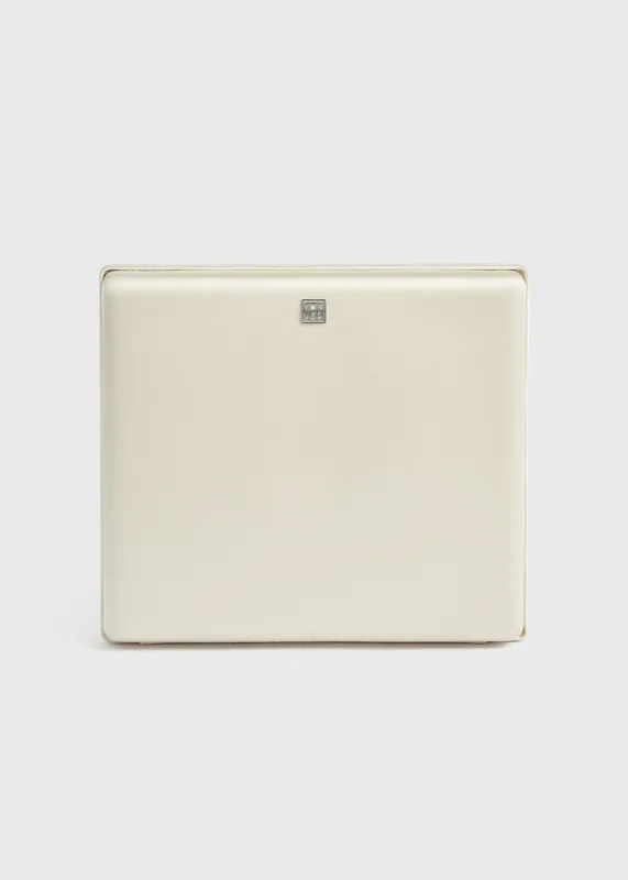 Satin box clutch ecru sold by Toteme
