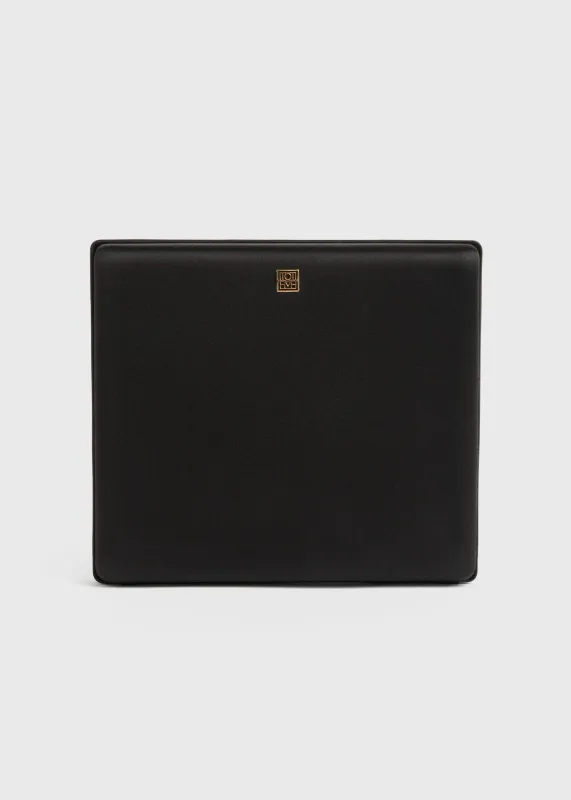 Satin box clutch black sold by Toteme