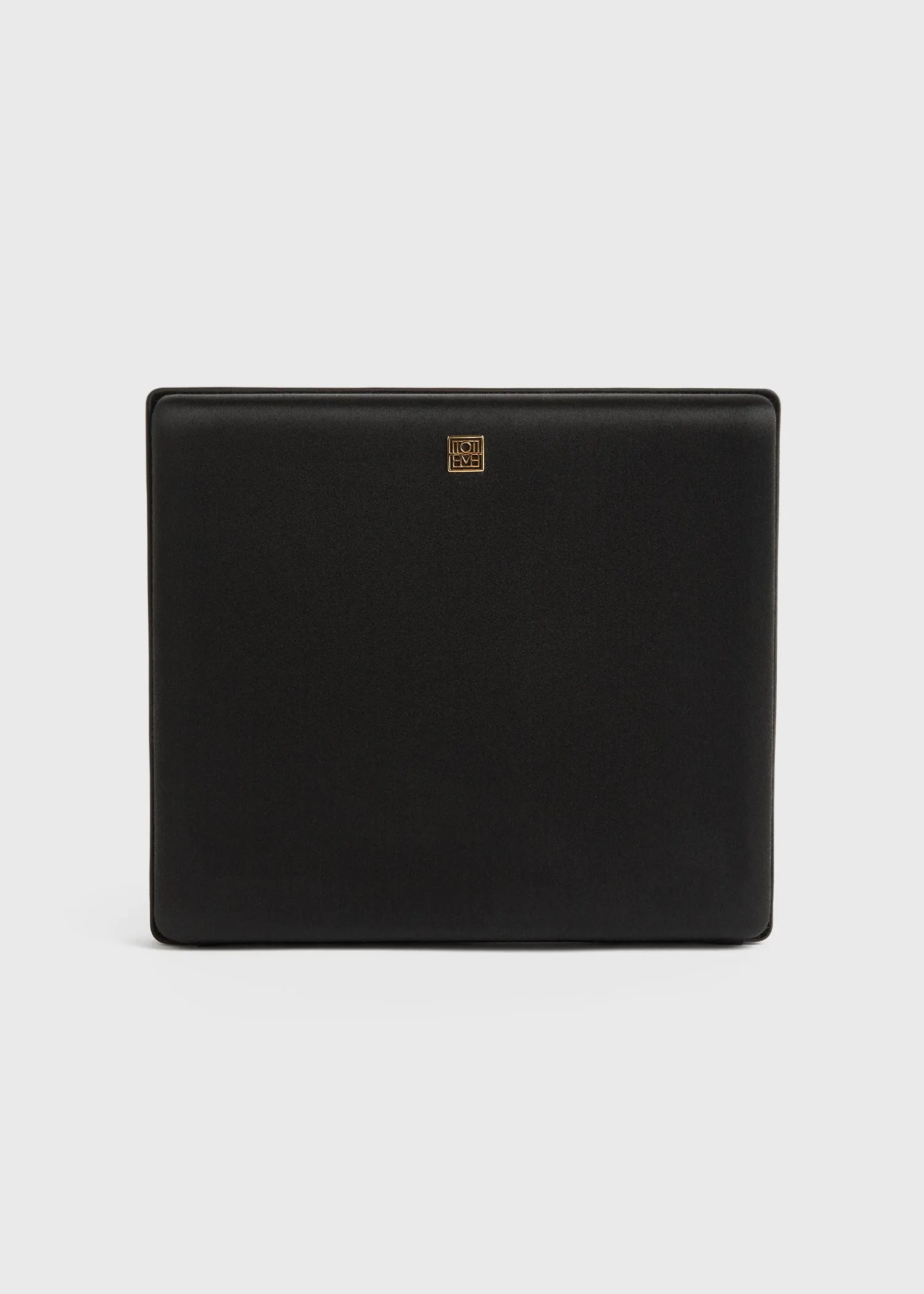 Satin box clutch black sold by Toteme