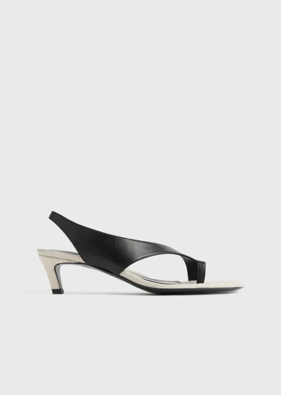 Leather heeled thong sandals black/sand sold by Toteme