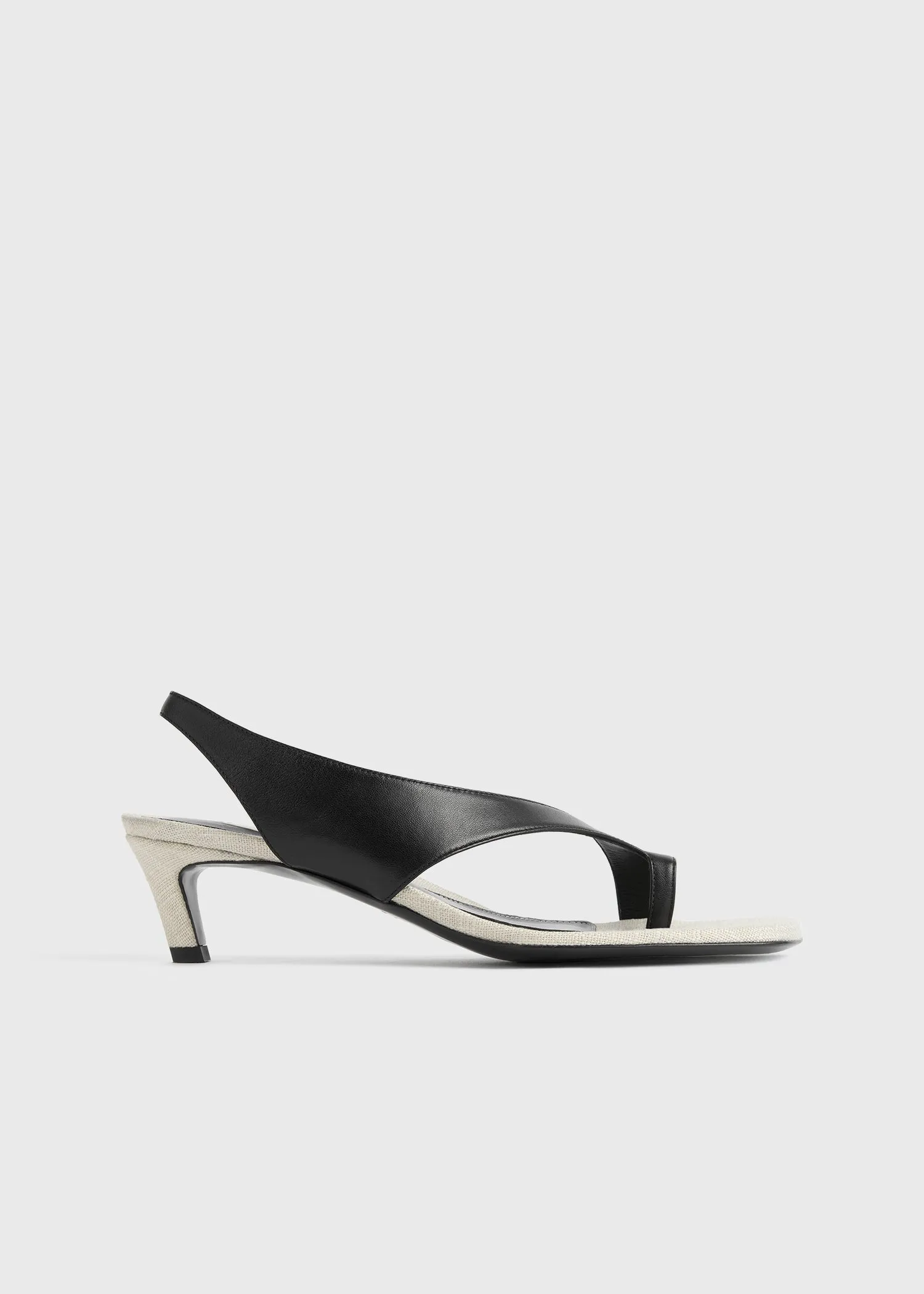 Leather heeled thong sandals black/sand sold by Toteme