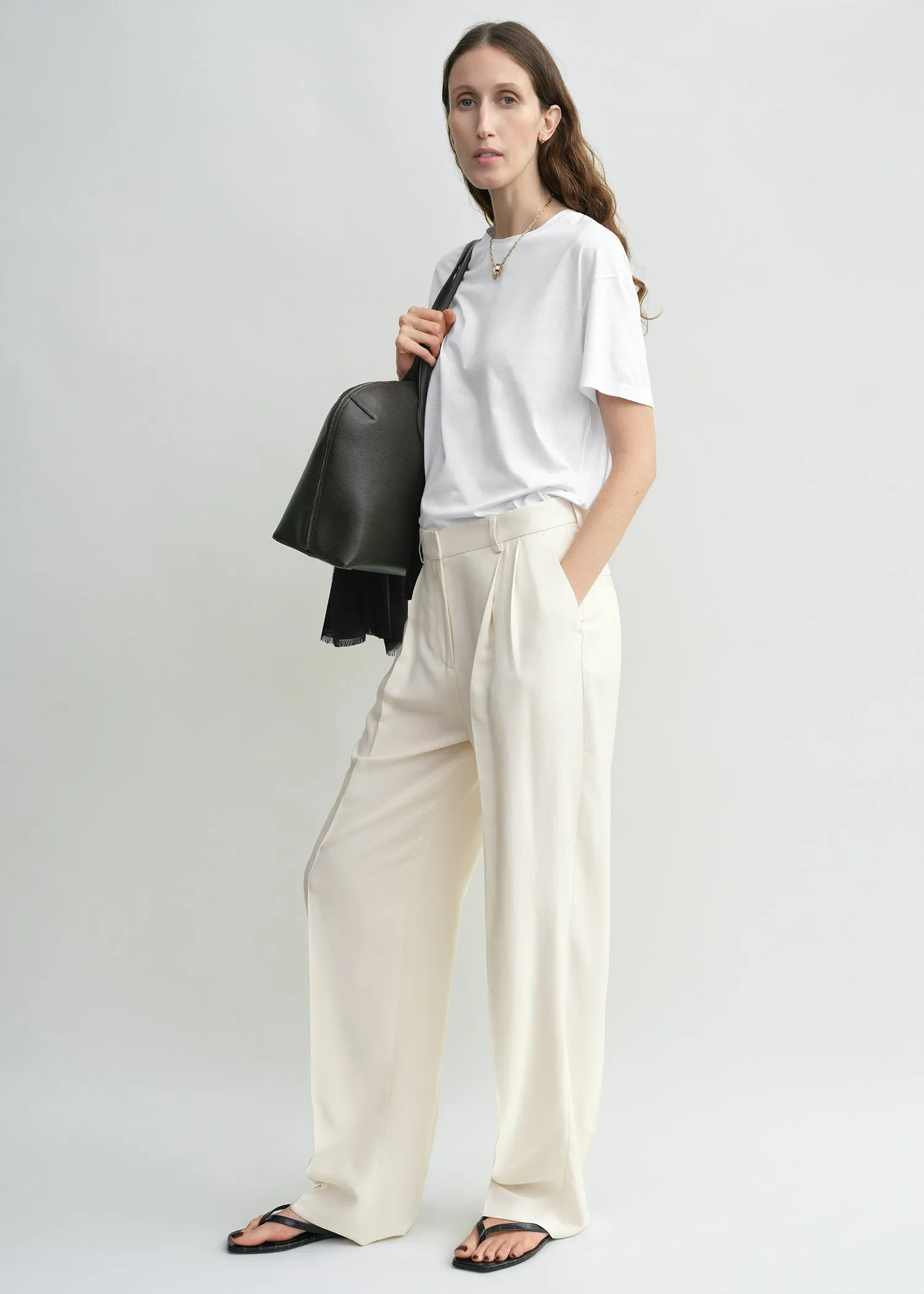 Double-pleat fluid trousers ecru sold by Toteme