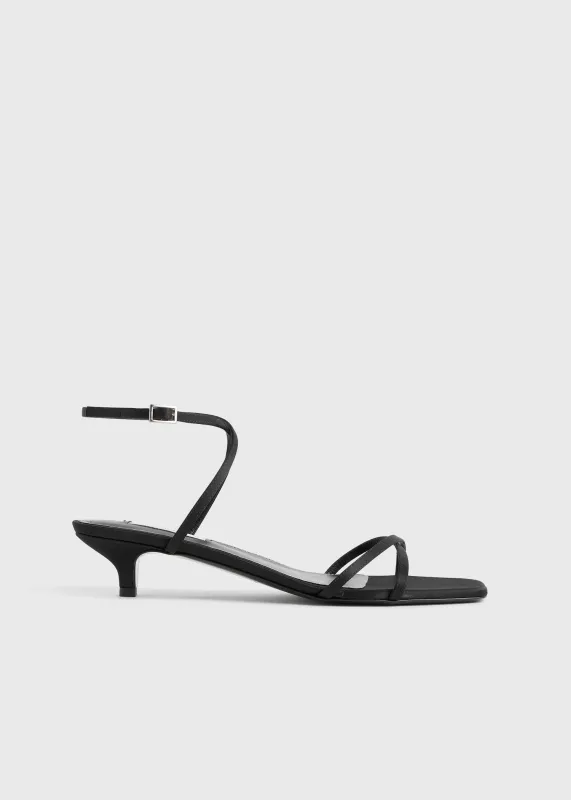 Satin crossover sandals black sold by Toteme