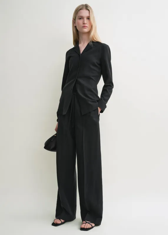 Fluid shirt black sold by Toteme