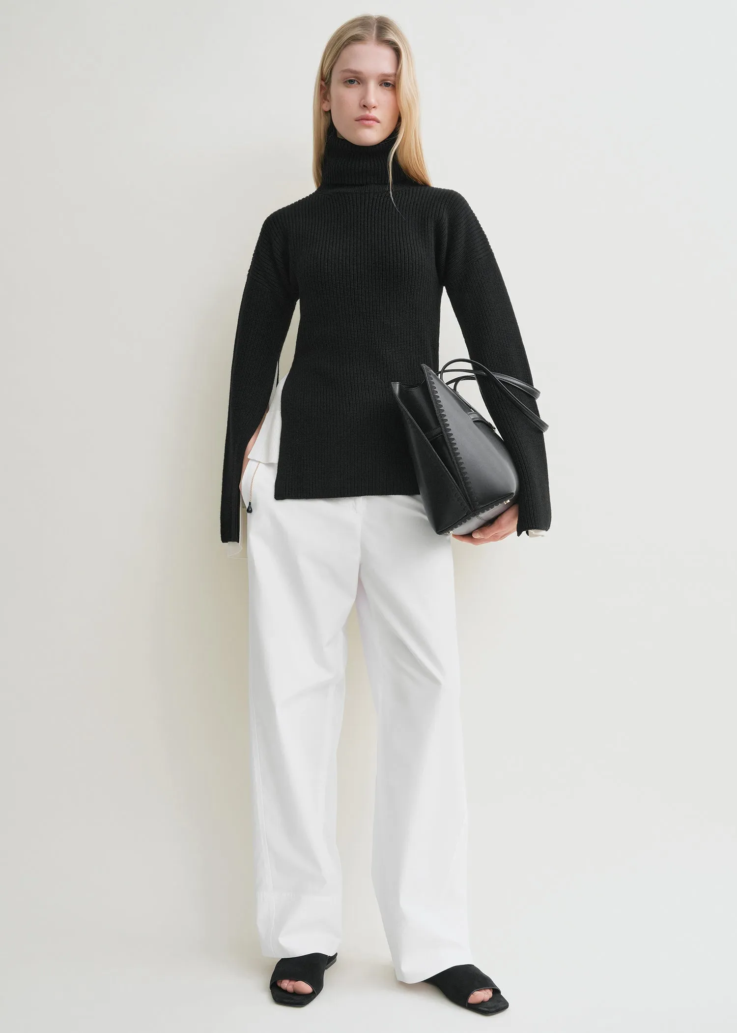 Slit sleeve knit black sold by Toteme