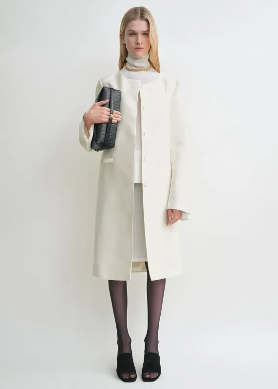 Collarless coat off-white sold by Toteme
