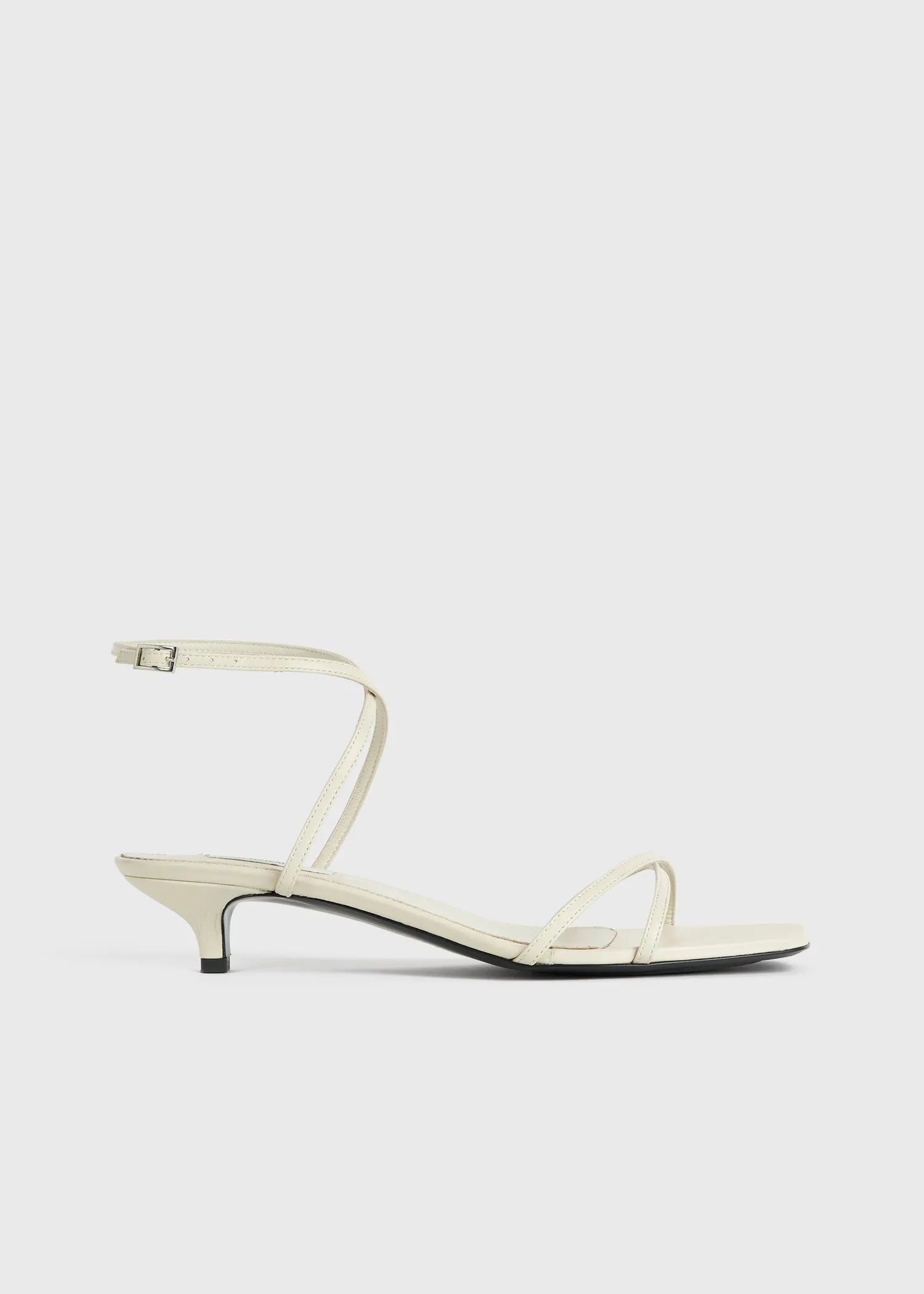 Leather crossover sandals off-white sold by Toteme