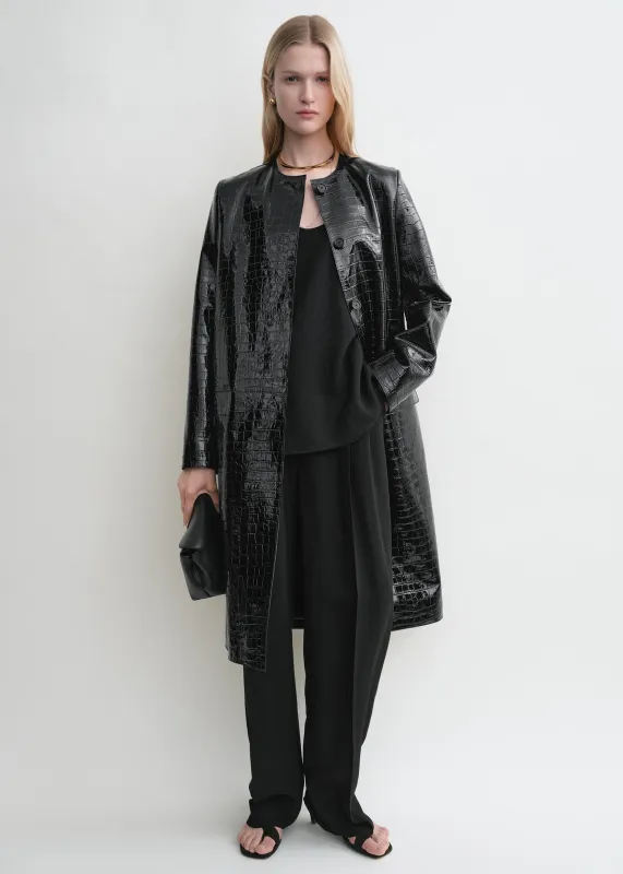 Croco-embossed coat black sold by Toteme