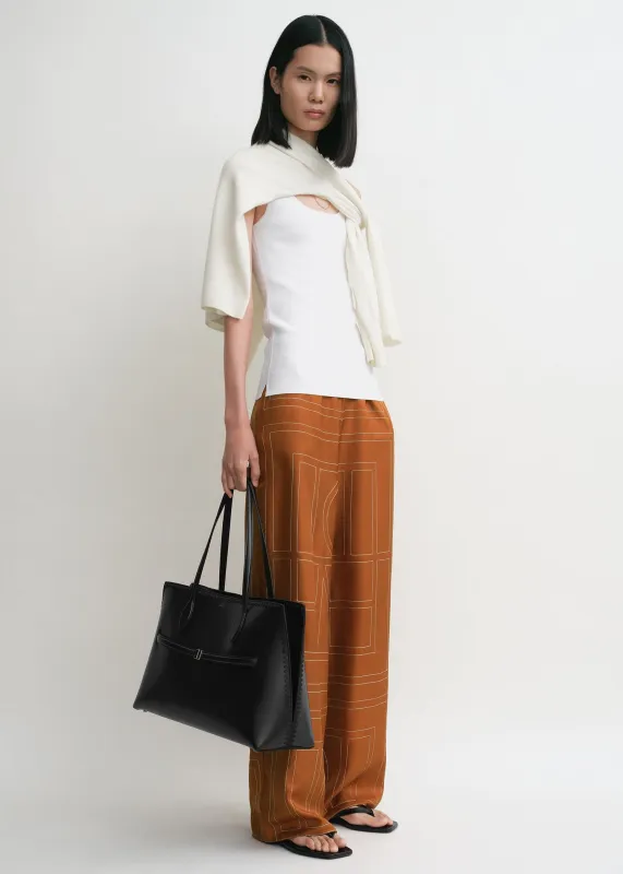 Monogram silk pj bottoms terracotta sold by Toteme